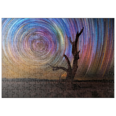 Darstellung des Puzzle Motivs puzzleplate Colorful Star Trails Above Barren Tree – Night Sky Spiral 200 Puzzle