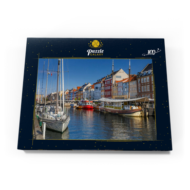 Darstellung des Puzzle Motivs Boote am Stichkanal Nyhavn im Stadtteil Frederiksstaden 100 Puzzle Schachtel Ansicht3