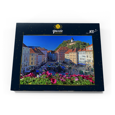 Darstellung des Puzzle Motivs Hauptplatz mit Blick zum Schlossberg und dem Uhrturm - Österreich 100 Puzzle Schachtel Ansicht3