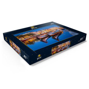 Darstellung des Puzzle Motivs Boote der moliceiros, der ehemaligen Tangfischer auf dem Kanal in der Universitätsstadt Aveiro 100 Puzzle Schachtel Ansicht1