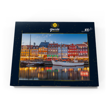Darstellung des Puzzle Motivs Abend am Stichkanal Nyhavn im Stadtteil Frederiksstaden 100 Puzzle Schachtel Ansicht3