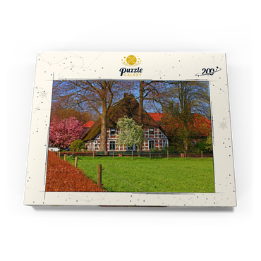Darstellung des Puzzle Motivs Bauernhaus in Sauensiek, Niedersachsen, Deutschland 200 Puzzle Schachtel Ansicht3