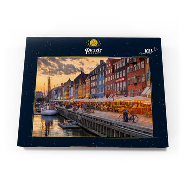 Darstellung des Puzzle Motivs Abendstimmung am Stichkanal Nyhavn im Stadtteil Frederiksstaden 100 Puzzle Schachtel Ansicht3