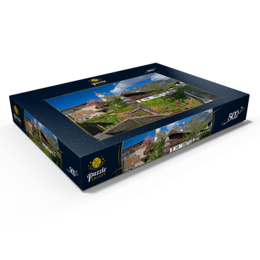 Darstellung des Puzzle Motivs Polznkasparhaus mit Kirche St. Martin am Mohrenplatz in Garmisch-Partenkirchen 500 Puzzle Schachtel Ansicht1