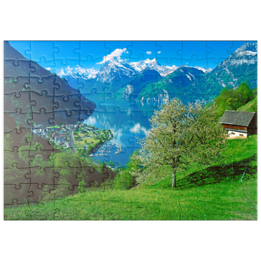 Darstellung des Puzzle Motivs puzzleplate Blick auf das Dorf am See gegen Gitschen und Urirotstock 100 Puzzle