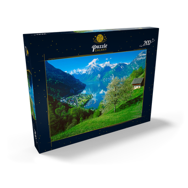 Darstellung des Puzzle Motivs Blick auf das Dorf am See gegen Gitschen und Urirotstock 200 Puzzle Schachtel Ansicht2