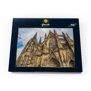 Darstellung des Puzzle Motivs Kölner Dom, Denkmal des deutschen Katholizismus und der gotischen Architektur in Köln. 200 Puzzle Schachtel Ansicht3