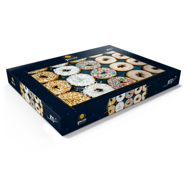 Darstellung des Puzzle Motivs Frische Donuts mit verschiedenen Belägen aus der örtlichen Bäckerei. 100 Puzzle Schachtel Ansicht1