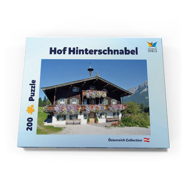 Darstellung des Puzzle Motivs Bergdoktor-Praxis in Ellmau in Tirol, Wilder Kaiser, Österreich 200 Puzzle Schachtel Ansicht3