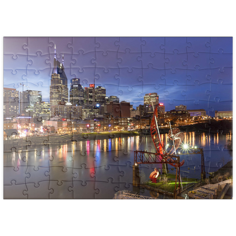 Darstellung des Puzzle Motivs Nashville Skyline mit Spiegelungen des Cumberland River in der Abenddämmerung puzzleplate Nashville Skyline with Cumberland River Reflections at Dusk 100 Puzzle