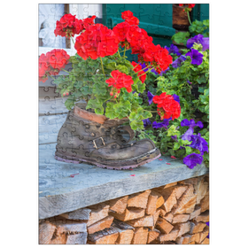 Darstellung des Puzzle-Motivs Alter Wanderstiefel mit Geranien in Oberstdorf – Puzzleteile: 200