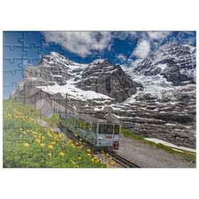 Darstellung des Puzzle Motivs Jungfraubahn an der Station Eiger Gletscher gegen Eiger und Mönch - Puzzleteile: 100