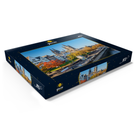 Darstellung des Puzzle Motivs Rheinuferpromenade mit den Türmen der Kirche Groß St. Martin und dem Dom - Puzzleteile: 100