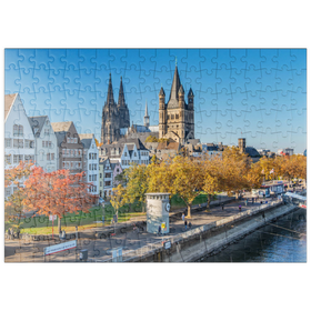 Darstellung des Puzzle-Motivs Rheinuferpromenade mit den Türmen der Kirche Groß St. Martin und dem Dom – Puzzleteile: 200