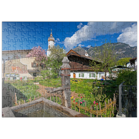 Darstellung des Puzzle-Motivs Polznkasparhaus mit Kirche St. Martin am Mohrenplatz in Garmisch-Partenkirchen – Puzzleteile: 200