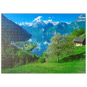 Darstellung des Puzzle Motivs Blick auf das Dorf am See gegen Gitschen und Urirotstock - Puzzleteile: 500