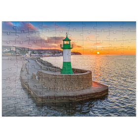 Darstellung des Puzzle Motivs Leuchtturm bei Sonnenaufgang an der Hafenmole - Puzzleteile: 100