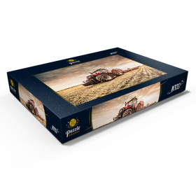 Darstellung des Puzzle Motivs Moderner roter Traktor bei der Einsaat - Puzzleteile: 1000