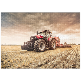 Darstellung des Puzzle Motivs Moderner roter Traktor bei der Einsaat - Puzzleteile: 1000