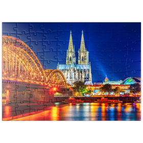 Darstellung des Puzzle Motivs Nachtsicht auf den Kölner Dom und Hohenzollernbrücke über Rhein, Deutschland - Puzzleteile: 100